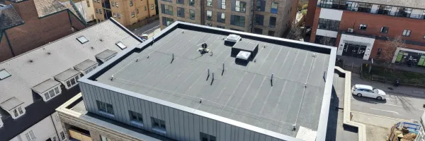 Bath Store, Tonbridge Road, Maidstone — aerial view showing completed main roof with MOY Imper Paralon ARD/HS Plus charcoal grey capsheet and SFS horizontal lifeline system