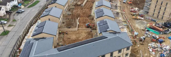 Aerial overview – Cambridge Crescent Phase 1, Maidstone. Pitched roofs in Cambrian Roof Tiles visible across the houses and apartment block foreground.