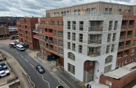 Street level view of the completed Purelake Sevenoaks apartment building with roof terrace above