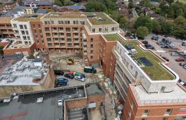 Aerial view across the Purelake Sevenoaks development showing green roofs on each block