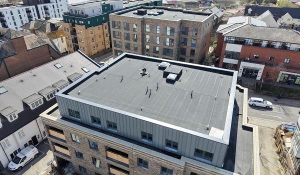 Bath Store, Tonbridge Road, Maidstone — aerial view showing completed main roof with MOY Imper Paralon ARD/HS Plus charcoal grey capsheet and SFS horizontal lifeline system