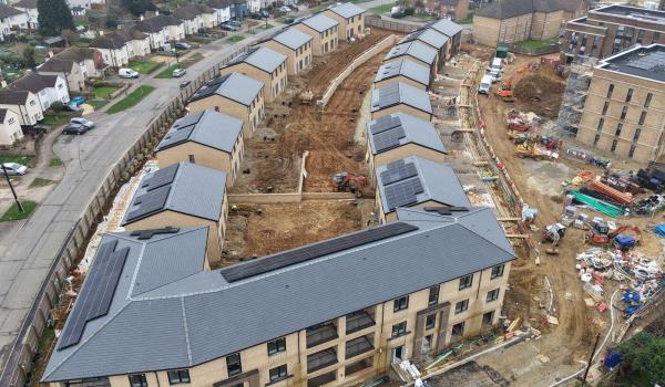 Aerial overview – Cambridge Crescent Phase 1, Maidstone. Pitched roofs in Cambrian Roof Tiles visible across the houses and apartment block foreground.