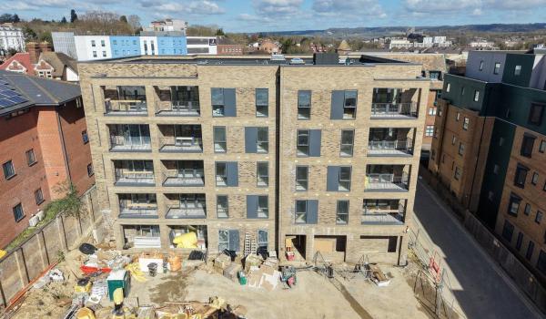 Corbens Place – south elevation showing completed balconies across all four floors (March 2026)