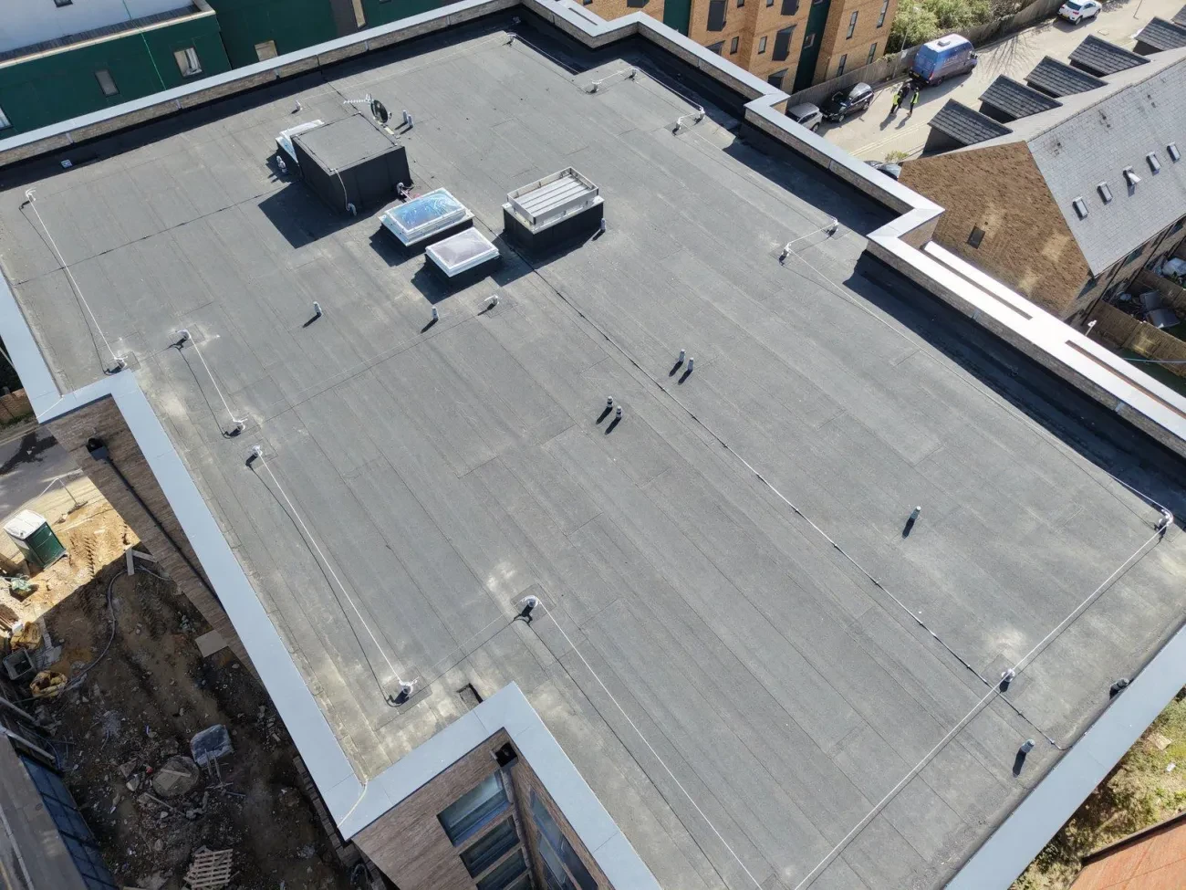 Oblique aerial view – completed main roof with rooflights, MOY RWOs, HLL wire (March 2026)
